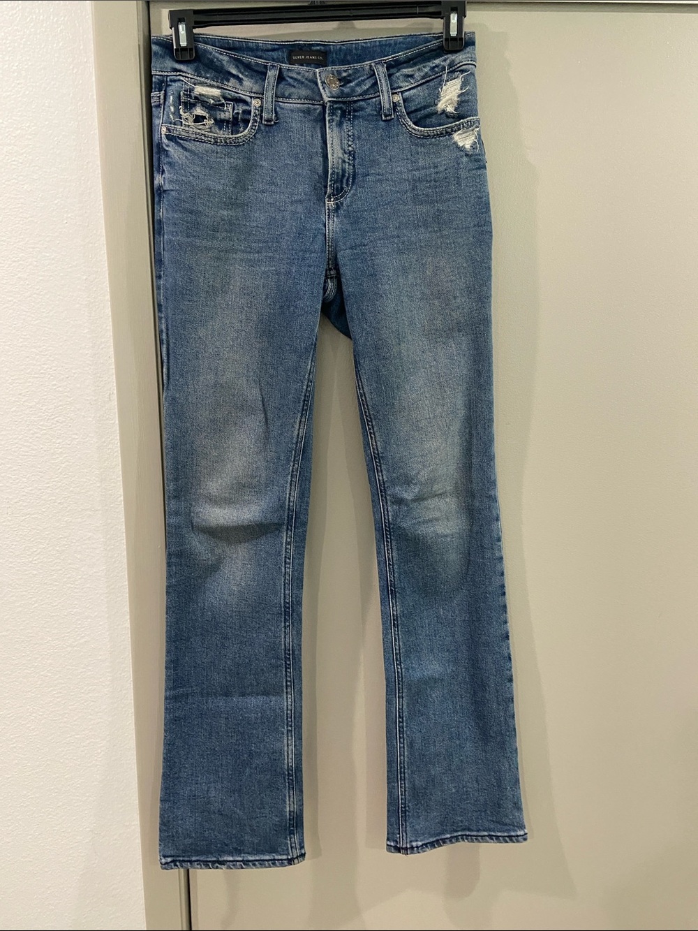 Silver Jeans Women's Light Blue Flare Jeans with Distressing